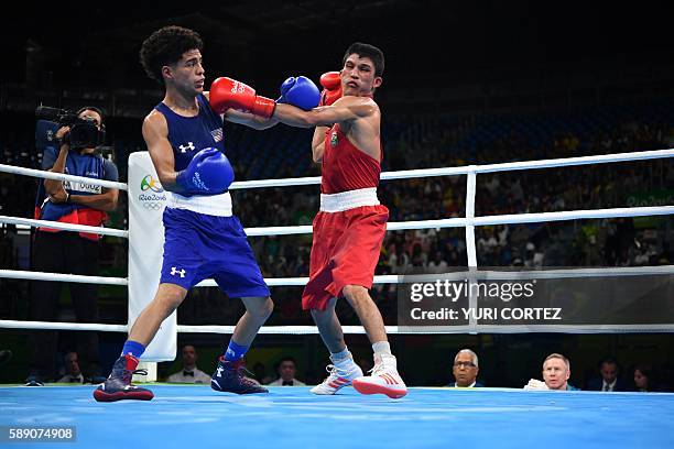 Brazil's Juliao Neto throws a punch towards USA's Antonio Vargas during the Men's Fly at the Rio 2016 Olympic Games at the Riocentro - Pavilion 6 in...