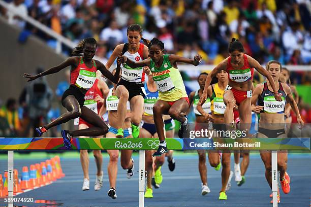 Xinyan Zhang of China, Etenesh Diro of Ethiopia and Hyvin Kiyeng Jepkemoi of Kenya compete in the Women's 3000m Steeplechase Round 1 on Day 8 of the...