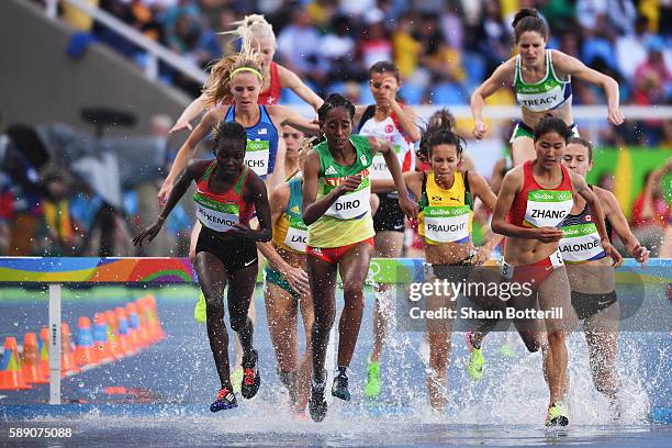 Xinyan Zhang of China, Etenesh Diro of Ethiopia and Hyvin Kiyeng Jepkemoi of Kenya compete in the Women's 3000m Steeplechase Round 1 on Day 8 of the...