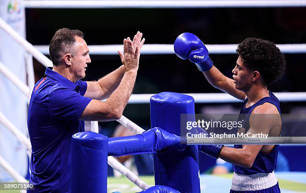 Rio , Brazil - 13 August 2016; Antonio Vargas of USA celebrates his victory over Juliao Neto of Brazil with Team USA boxing coach Billy Walsh during...