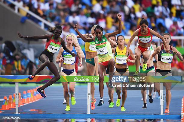 Xinyan Zhang of China, Etenesh Diro of Ethiopia and Hyvin Kiyeng Jepkemoi of Kenya compete in the Women's 3000m Steeplechase Round 1 on Day 8 of the...