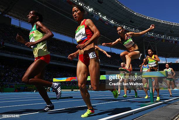 Xinyan Zhang of China and Etenesh Diro of Ethiopia compete in the Women's 3000m Steeplechase Round 1 on Day 8 of the Rio 2016 Olympic Games at the...