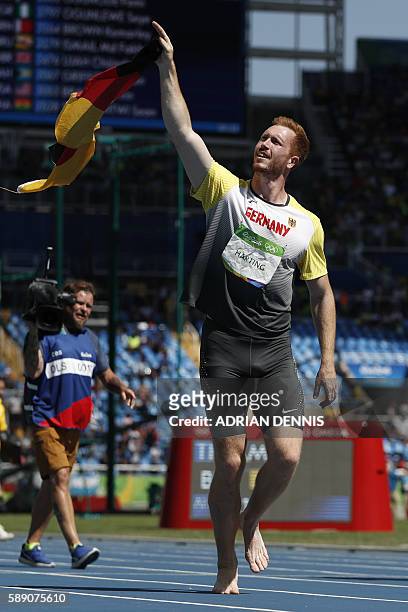 Gold medallist Germany's Christoph Harting celebrates winning the Men's Discus Throw Final during the athletics event at the Rio 2016 Olympic Games...