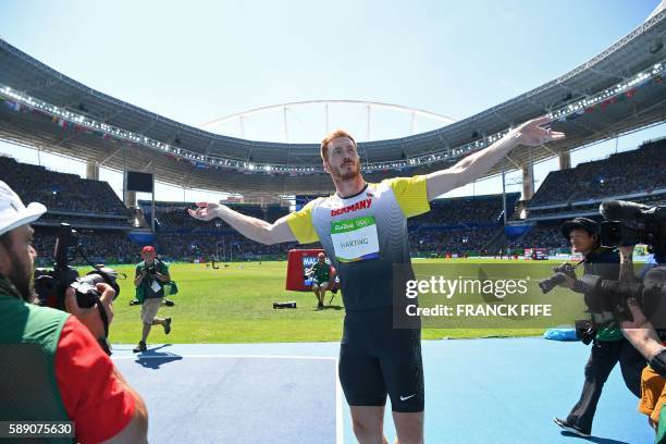 Gold medallist Germany's Christoph Harting celebrates winning the Men's Discus Throw Final during the athletics event at the Rio 2016 Olympic Games...