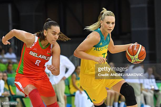 Australia's forward Penny Taylor works around Belarus' shooting guard Tatsiana Likhtarovich during a Women's round Group A basketball match between...