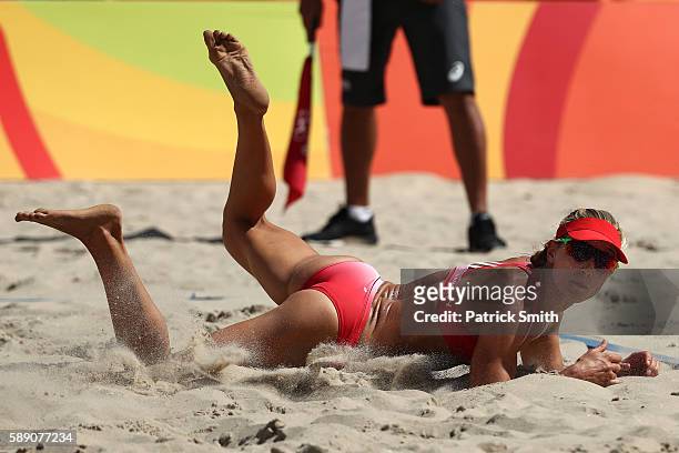 Heather Bansley of Canada dives for the ball during a Women's Round of 16 match between Canada and Canada on Day 8 of the Rio 2016 Olympic Games at...