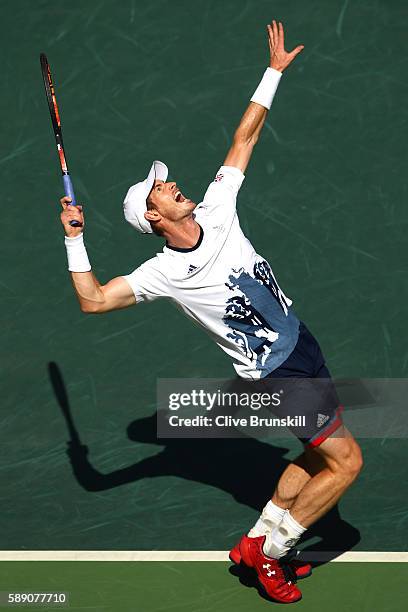 Andy Murray of Great Britain serves to Kei Nishikori of Japan during the Men's Singles Semifinal Match on Day 8 of the Rio 2016 Olympic Games at the...