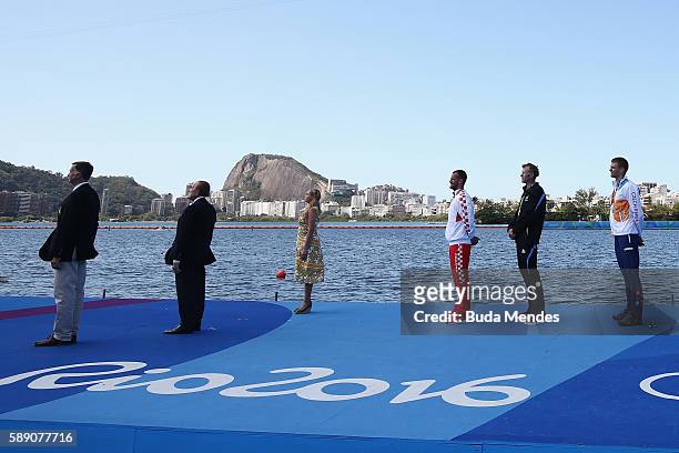 Silver medalist Damir Martin of Croatia, gold medalist Mahe Drysdale of New Zealand and bronze medalist Ondrej Synek of the Czech Republic pose on...