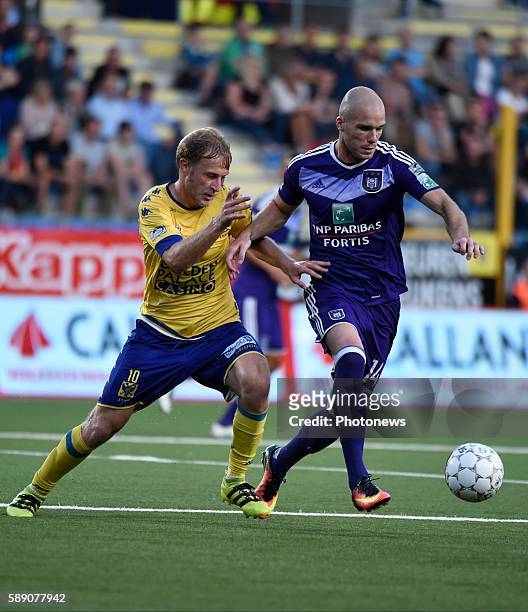 August 12: Bram Nuytinck defender of RSC Anderlecht and Roman Bezus midfielder of STVV pictured during the Jupiler Pro league match between STVV and...