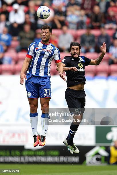 Yanic Wildschut of Wigan Athletic and Stephen Hendrie of Blackburn Rovers head the ball during the Sky Bet Championship League match between Wigan...
