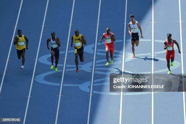 St Lucia's Jahvid Best, Britain's James Dasaolu, Jamaica's Usain Bolt, Trinidad and Tobago's Richard Thompson, Singapore's Yap Jin Wei Timothee, and...