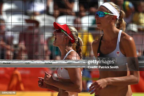 Heather Bansley of Canada celebrates after winning a Women's Round of 16 match while Kristina Valjas of Canada looks on during Day 8 of the Rio 2016...