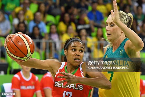 Belarus' guard Lindsey Harding works around Australia's forward Penny Taylor during a Women's round Group A basketball match between Australia and...
