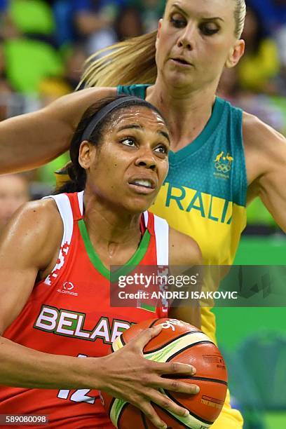 Belarus' guard Lindsey Harding works around Australia's forward Penny Taylor during a Women's round Group A basketball match between Australia and...