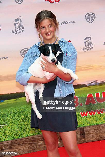 Actress Emma Schweiger and dog 'Frodo' attend the 'Conni & Co' Berlin premiere on August 13, 2016 in Berlin, Germany.