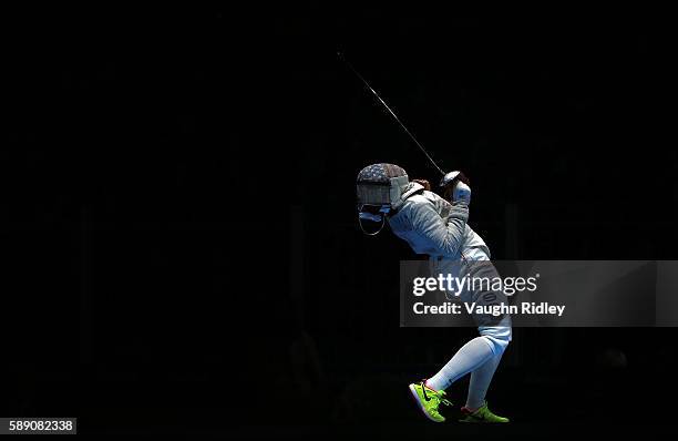 Ibtihaj Muhammad of the USA celebrates a point over Ekaterina Dyachenko of Russia in the Women's Sabre Team Semifinals on Day 8 of the Rio 2016...
