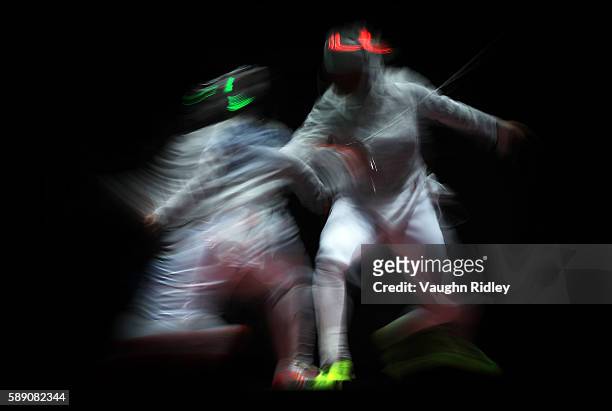 Aleksandra Socha of Poland competes against Ibtihaj Muhammad of the USA in the Women's Sabre Team Quarterfinals on Day 8 of the Rio 2016 Olympic...