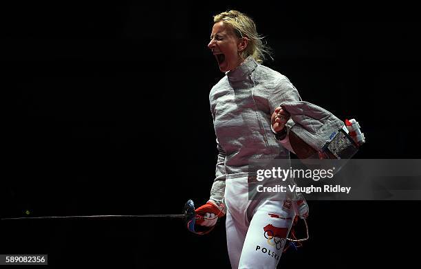 Aleksandra Socha of Poland celebrates a point against the USA in the Women's Sabre Team Quarterfinals on Day 8 of the Rio 2016 Olympic Games at the...