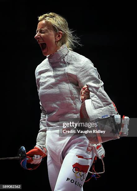 Aleksandra Socha of Poland celebrates a point against the USA in the Women's Sabre Team Quarterfinals on Day 8 of the Rio 2016 Olympic Games at the...