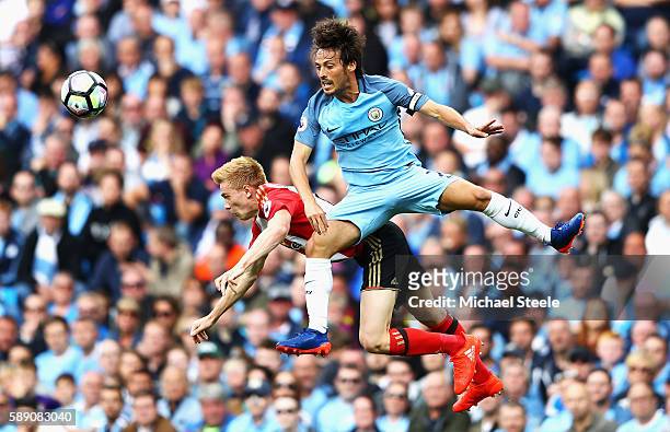 David Silva of Manchester City fouls Duncan Watmore of Sunderland during the Premier League match between Manchester City and Sunderland at Etihad...