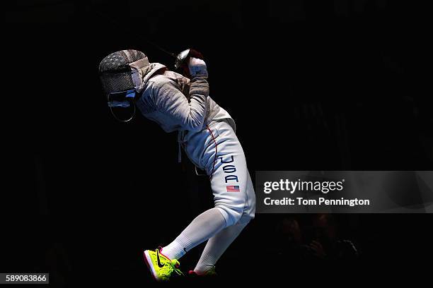 Ibtihaj Muhammad of the United States reacts against Sofya Velikaya of Russia during the Women's Sabre Team Semifinal 1 Russia vs United States at...