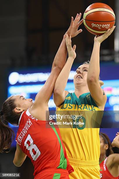 Tatsiana Likhtarovich of Belarus tries to block the shot of Rachel Jarry of Australia during the Women's round Group A basketball match between...