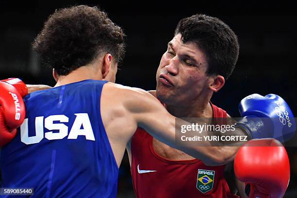 Brazil's Juliao Neto clenches to USA's Antonio Vargas during the Men's Fly at the Rio 2016 Olympic Games at the Riocentro - Pavilion 6 in Rio de...