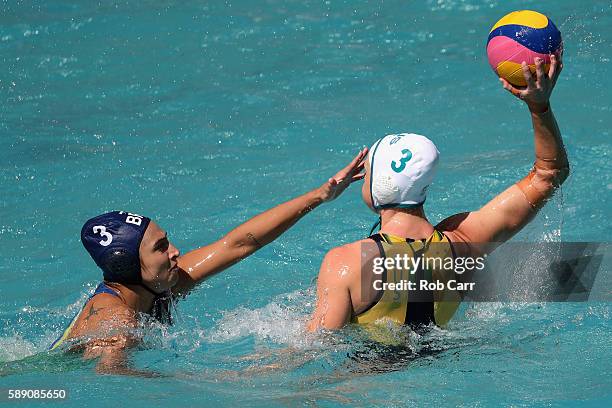 Hannah Buckling of Australia passes over Marina Zablith of Brazil during the Womens Preliminaries on Day 8 of the Rio 2016 Olympic Games on August...