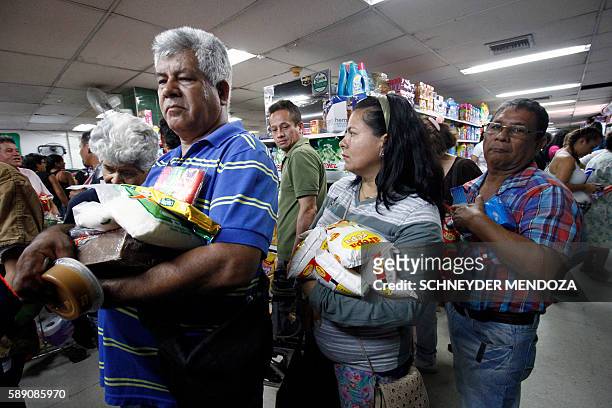 Venezuelans shop for groceries at a supermarket in Cucuta, Colombia on August 13, 2016. T Venezuela and Colombia on Saturday opened several...