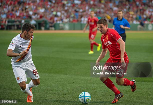 Michele Somma of AS Roma and Joe Allen of Liverpool FC during a pre-season match again at Fenway Park in Boston, MA on July 23, 2014. AS Roma won 1-0.