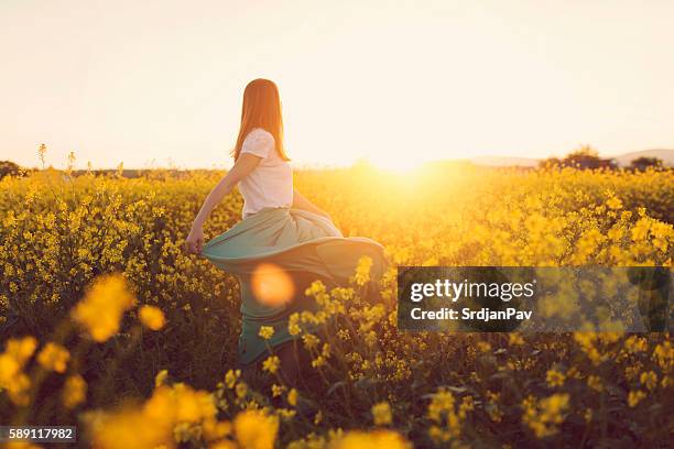 dancing with flowers - one young woman only stock pictures, royalty-free photos & images