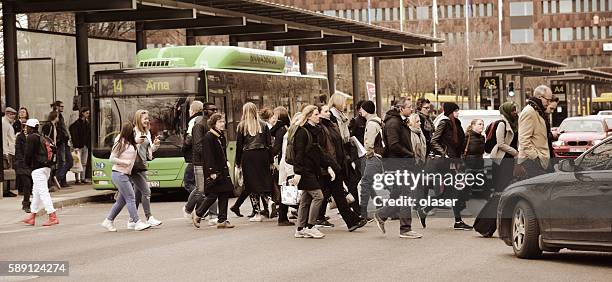 pedestrians on zebra crossing - uppsala stock pictures, royalty-free photos & images