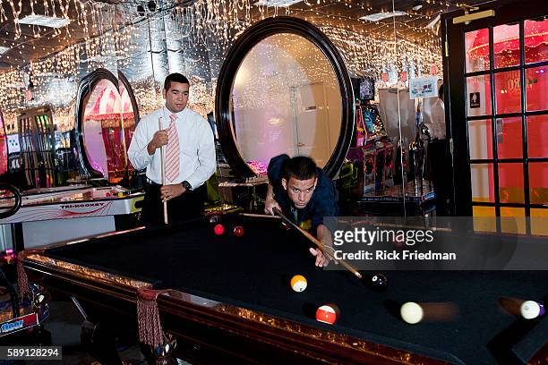 Erick Choez of Brooklyn and David Soriano of New York play pool as a reward for good behavior on Rewards Street inside Judge Rotenberg Center. The...