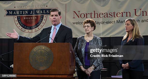 Boston Mayor elect Martin J. Walsh, the day before he is sworn in as Boston's new mayor, at a seniors luncheon with his girlfriend Lorrie Higgins and...