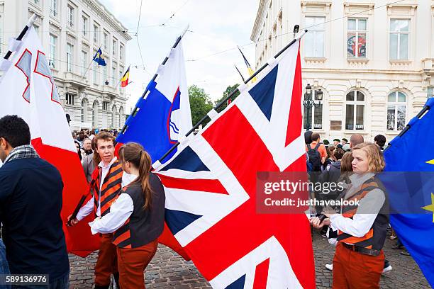 carrying british union jack - national day of belgium 2016 imagens e fotografias de stock