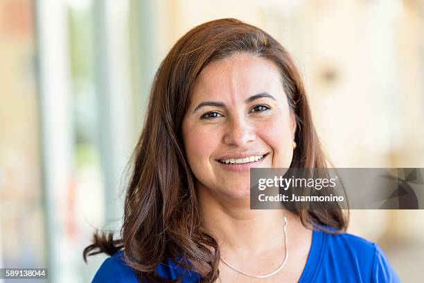 mature hispanic woman - stereotypical homemaker stock pictures, royalty-free photos & images