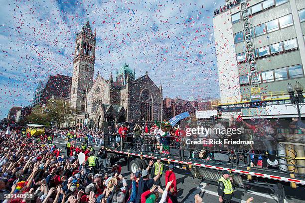 "Wally the Green Monster" the Red Sox mascot and the Dropkick Murphys during the Boston Red Sox World Series victory Rolling Rally as it passes...