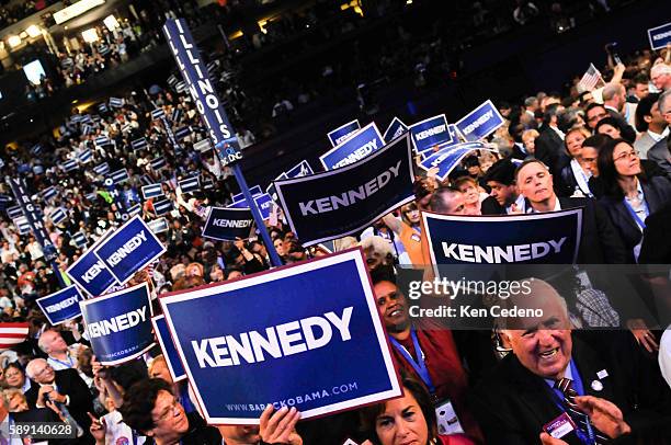 Crowds of delegates at the Democratic National Convention wave Kennedy signs after Senator Ted Kennedy addressed the audience at the Pepsi Center in...