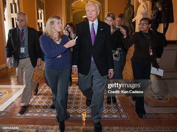 Senator Orin Hatch, is surrounded by reporters on Capitol Hill December 31, 2012 in Washington D.C. While Congressional Leaders try to work out a...