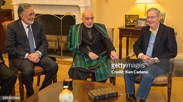President of Afghanistan Hamid Karzai, center, and Foreign Minister Zalmay Razul, left, meets with U.S. Senator Mitch McConnell , right, along with...