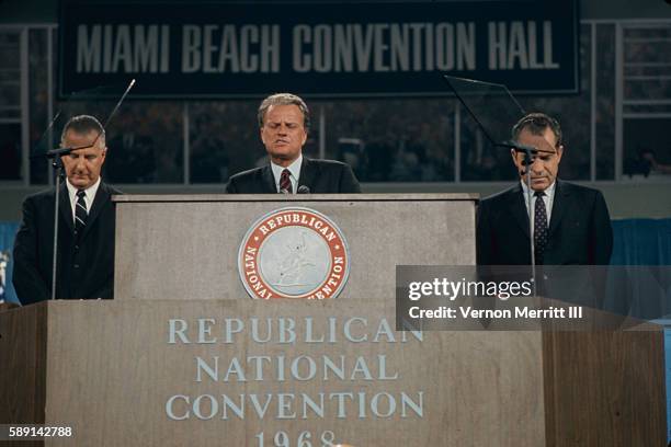 American evanelist Billy Graham leads a prayer from the podium during the Republican National Convention at the Miami Beach Convention Center, Miami...