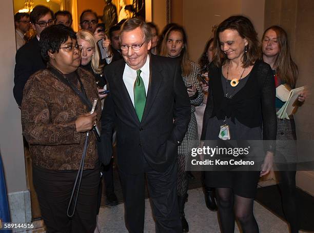 Minority Leader Senator Mitch McConnell walks from the Senate floor to his office working in a possible deal to prevent the 'fiscal cliff', on...