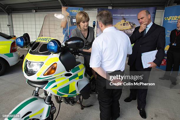 Scotland's then deputy First Minister and health minister in the Scottish Executive, Nicola Sturgeon MSP, pictured talking to member of staff during...