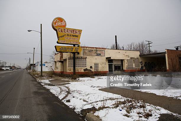 Abandoned dry cleaner. The decades-long decline of the U.S. Automobile industry is acutely reflected in the urban decay of Detroit, the city once...