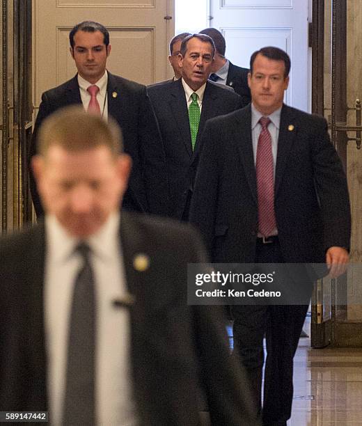 House Speaker John Boehner, , center rear, arrives at the U.S. Capitol in Washington, D.C., on Tues Jan 1, 2013. Congress is in session to discuss...