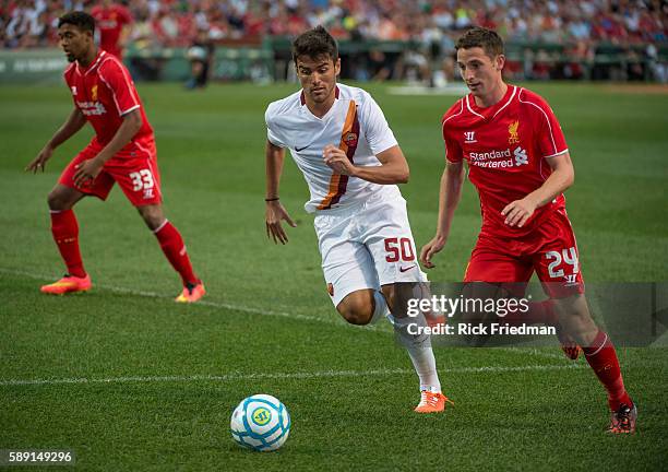 Michele Somma of AS Roma and Joe Allen of Liverpool FC during a pre-season match again at Fenway Park in Boston, MA on July 23, 2014. AS Roma won 1-0.