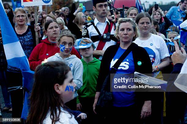 Women and children listening to speeches at a spontaneous event to mobilise support for a pro-independence vote in the Craigmillar district of...