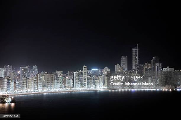skyscrapers lining waterfront - benidorm stock pictures, royalty-free photos & images