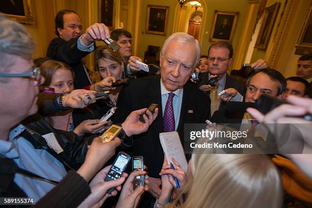 Senator Orin Hatch, is surrounded by reporters on Capitol Hill December 31, 2012 in Washington D.C. While Congressional Leaders try to work out a...