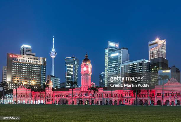 merdeka square and clock tower, at dusk - malaysia kuala lumpur merdeka square stock pictures, royalty-free photos & images